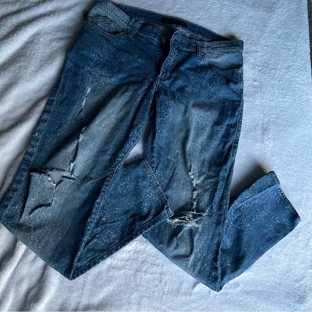 Splattered ripped jeans